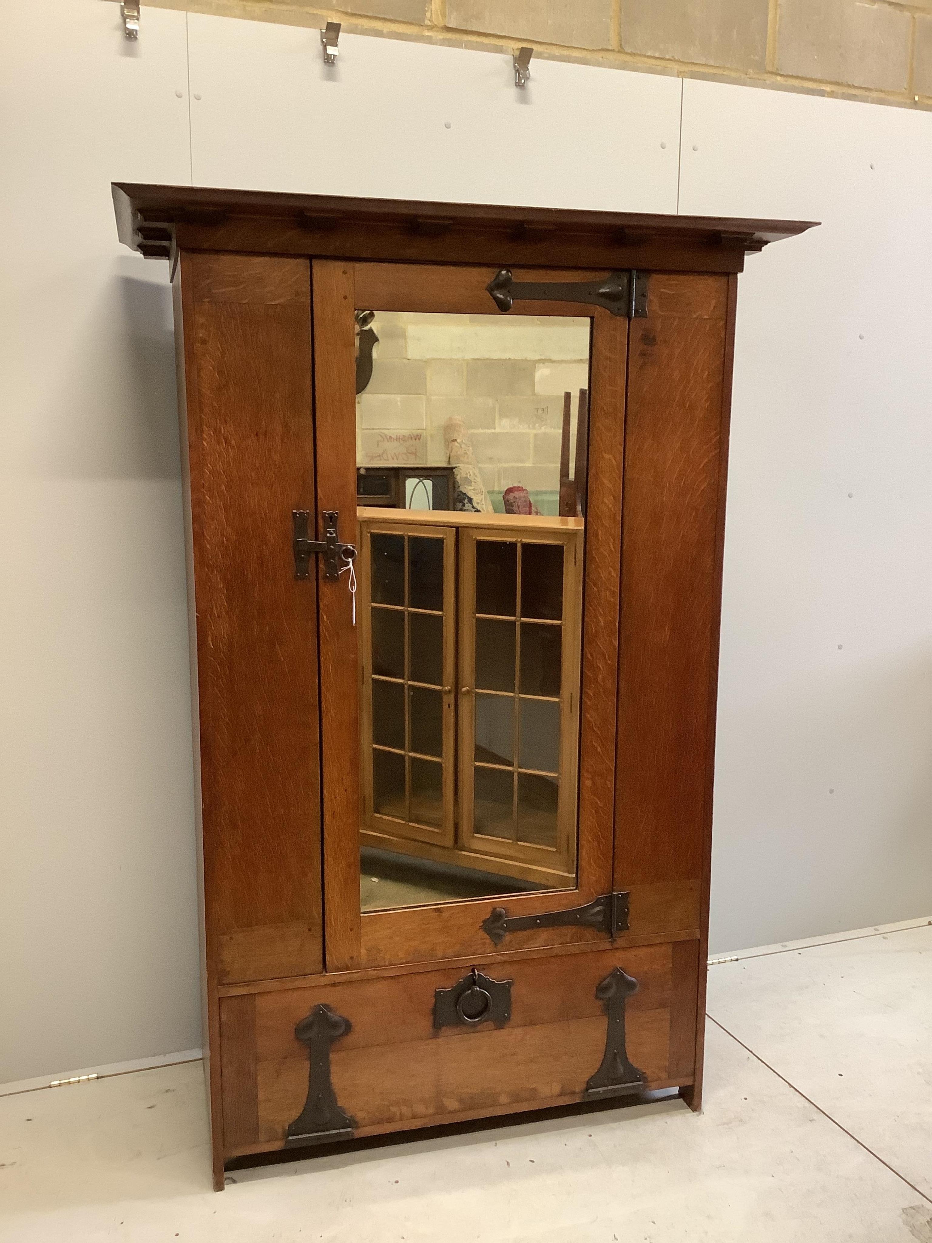 Ambrose Heal (1872-1959) for Heal & Son, London. A 'St Ives' oak wardrobe, c.1898, width 128cm, depth 61cm, height 189cm. Condition - good